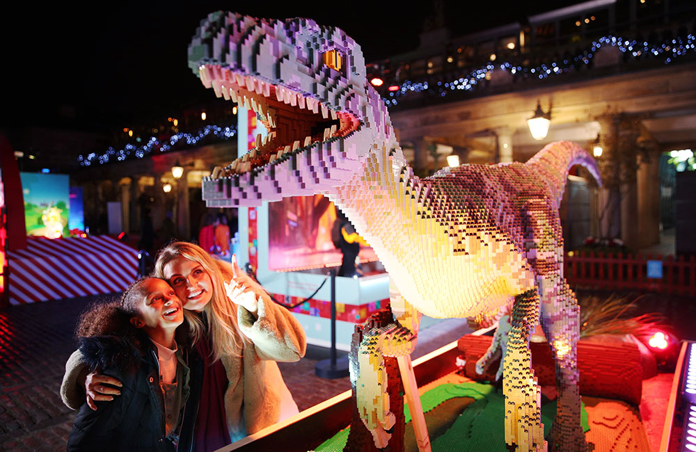 Mum and daughter looking at amazing Lego dinosaur