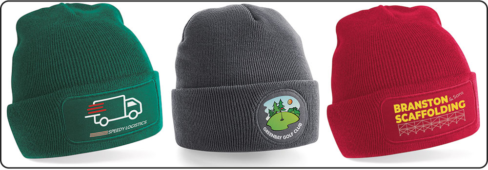 Row o 3 beanie hats in green grey and red