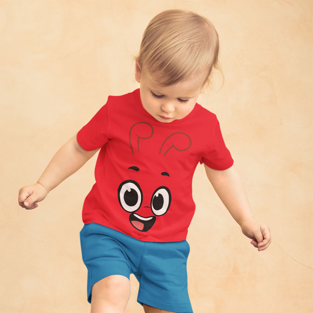 Blonded haired toddler in red T Shirt