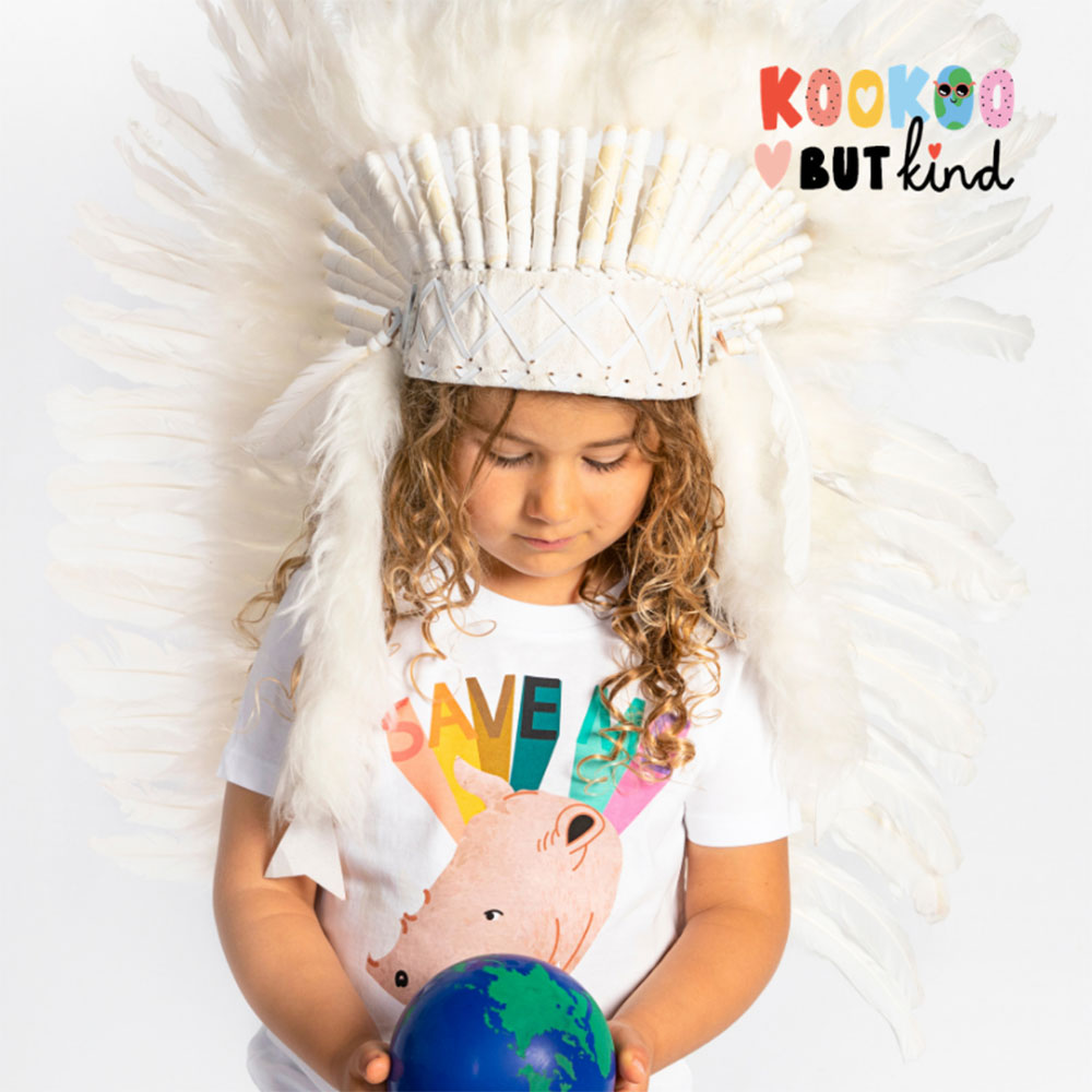 Girl with blonde curly hair wearing white indian headdress