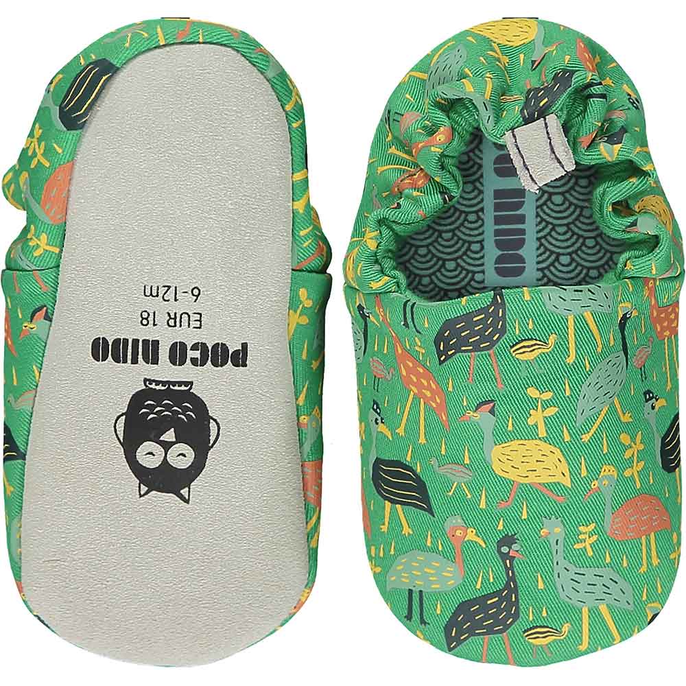 A pair of green Poco Nido shoes with birds on them