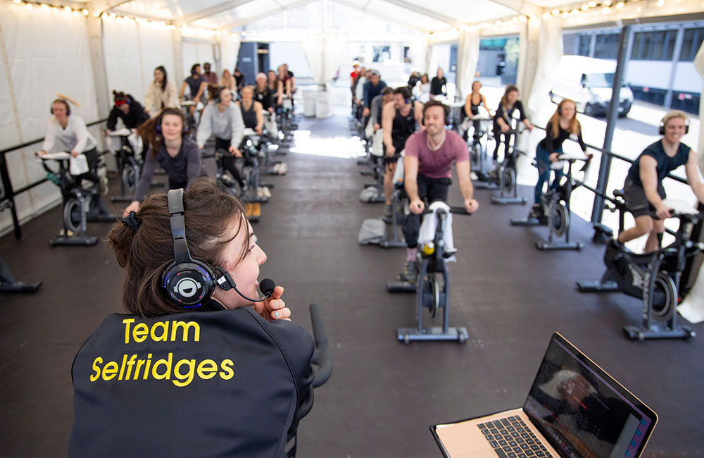 Fitness class with instructor in Team Selfridges jacket