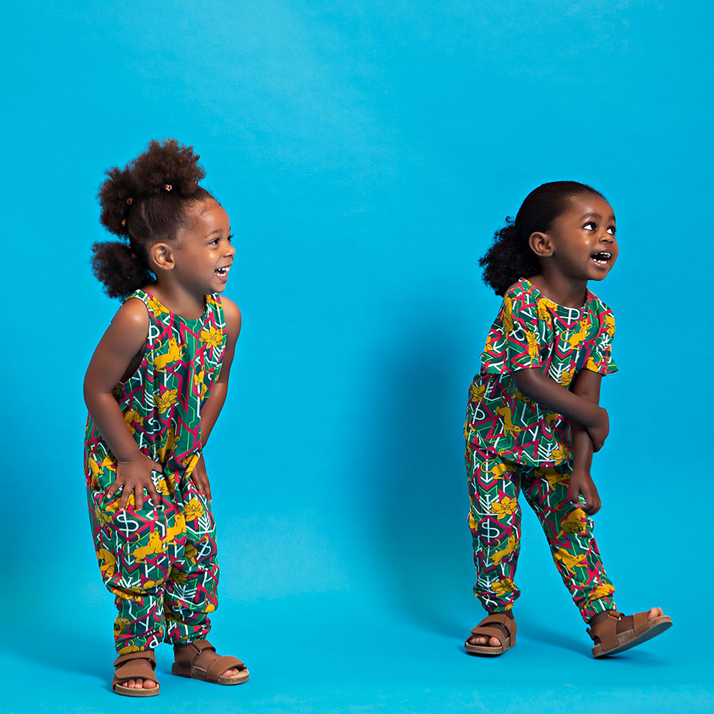 Two young children wearing African-inspired brand Akwa Baby