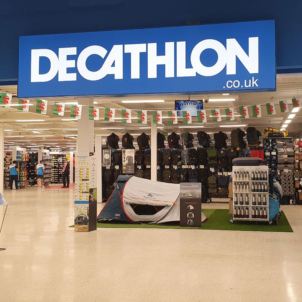 Decathlon blue and white sign above sports store