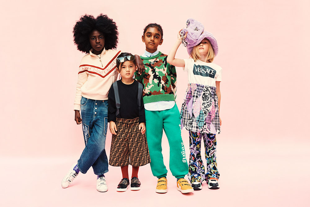 Four young kids luxury branded clothing