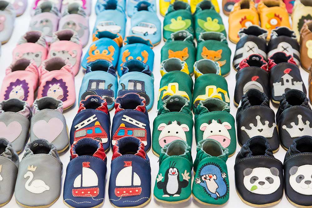 Pairs of children's shoes in different design styles