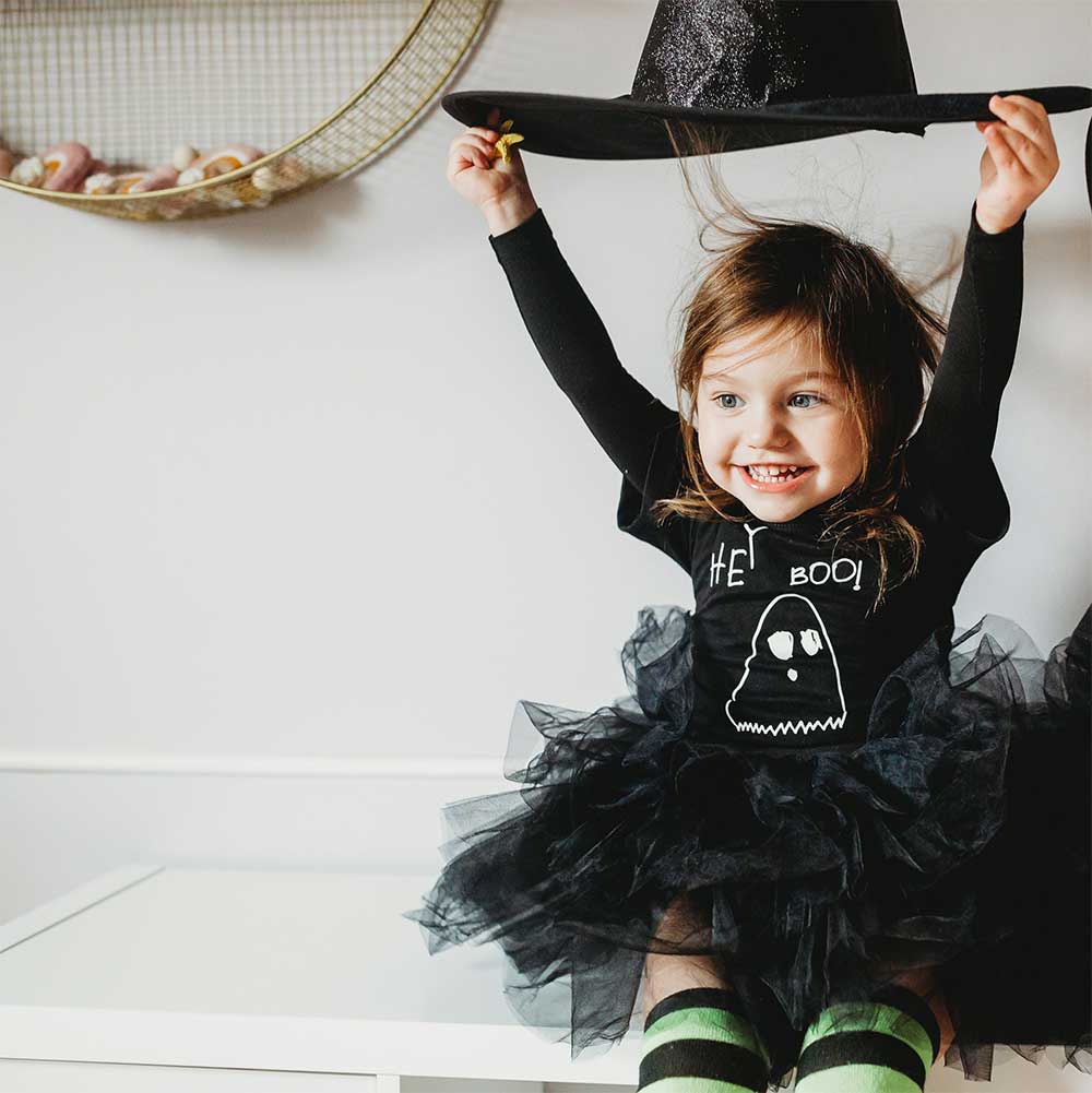 A young girl wearing a personalised Halloween outfit