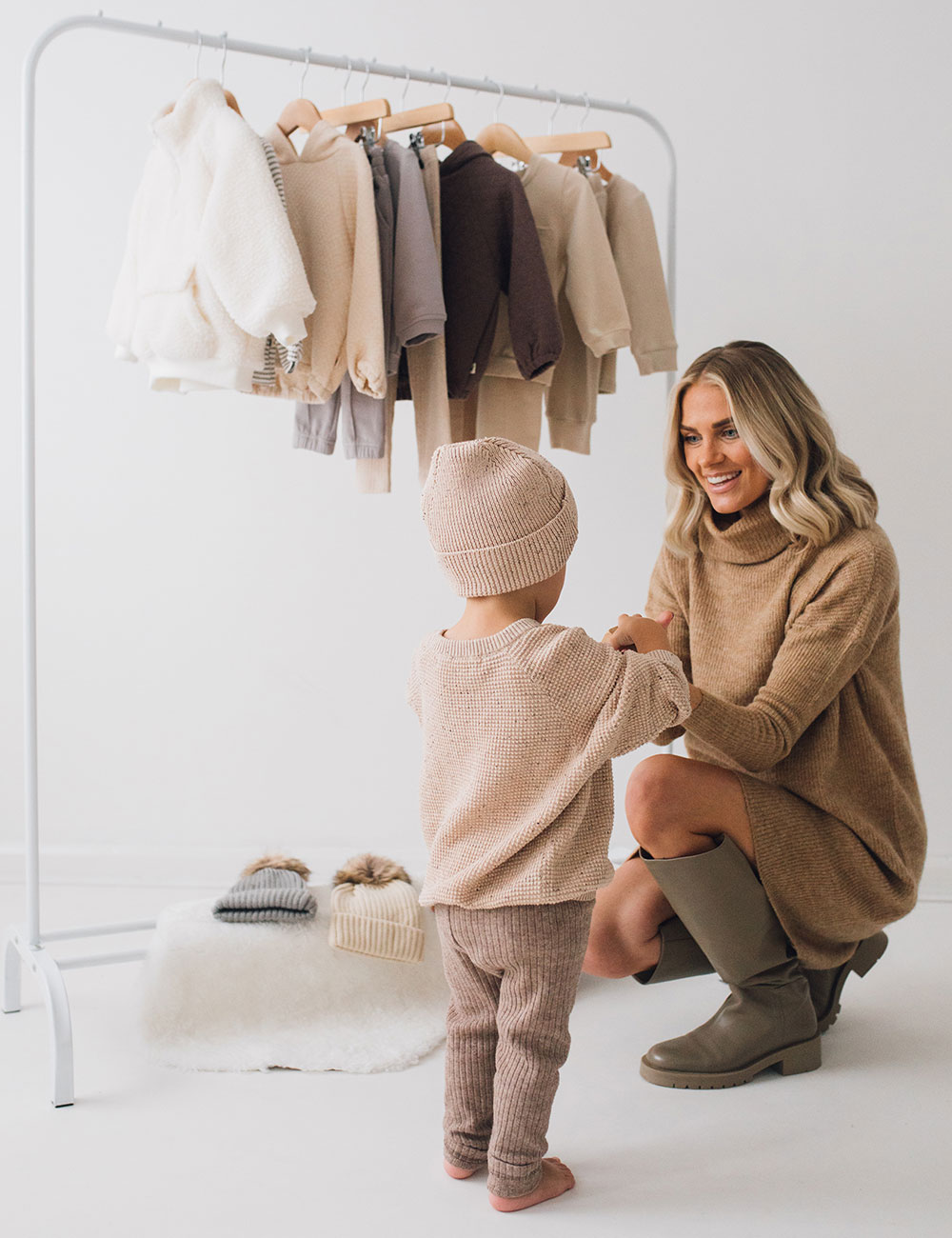 Influencer Kirst Green with young girl and BabyChum kids clothing on rail