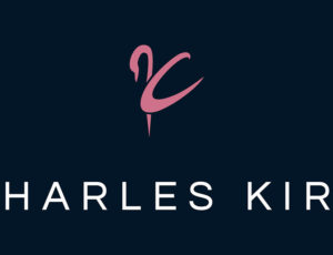 Blue and pink Charles Kirk schoolwear logo