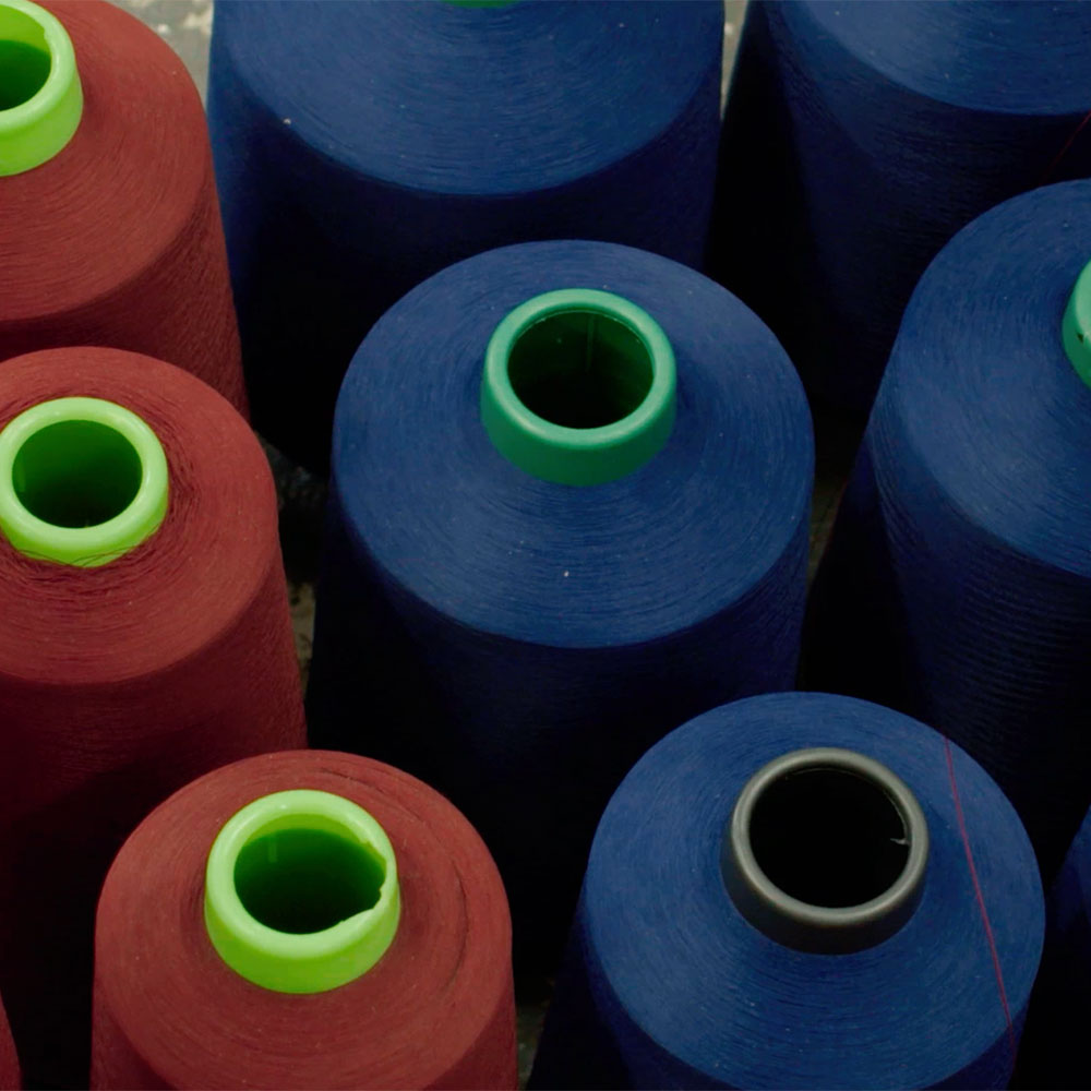 blue and red Cotton reels for weaving