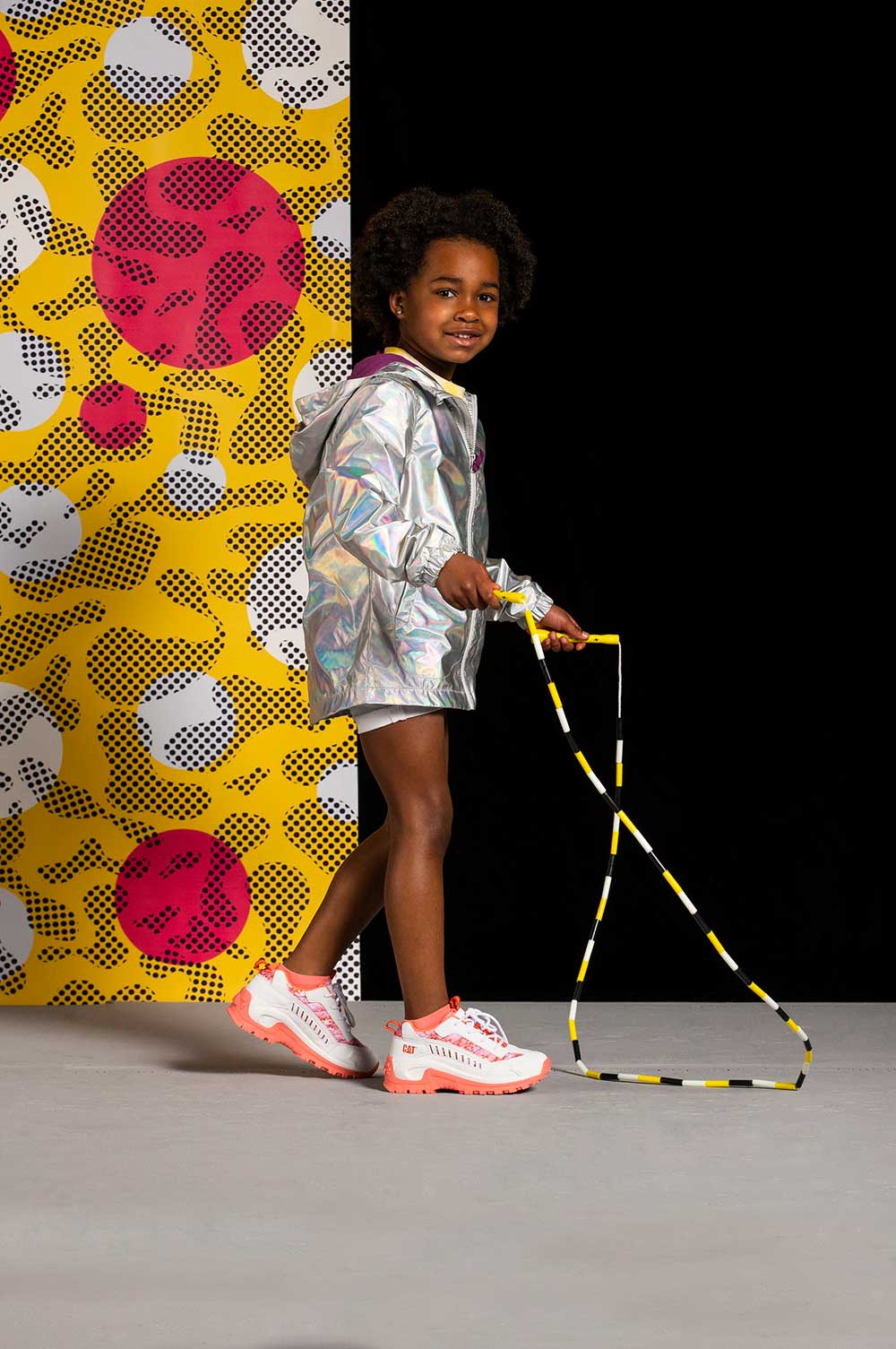 A young girl holding a skipping rope