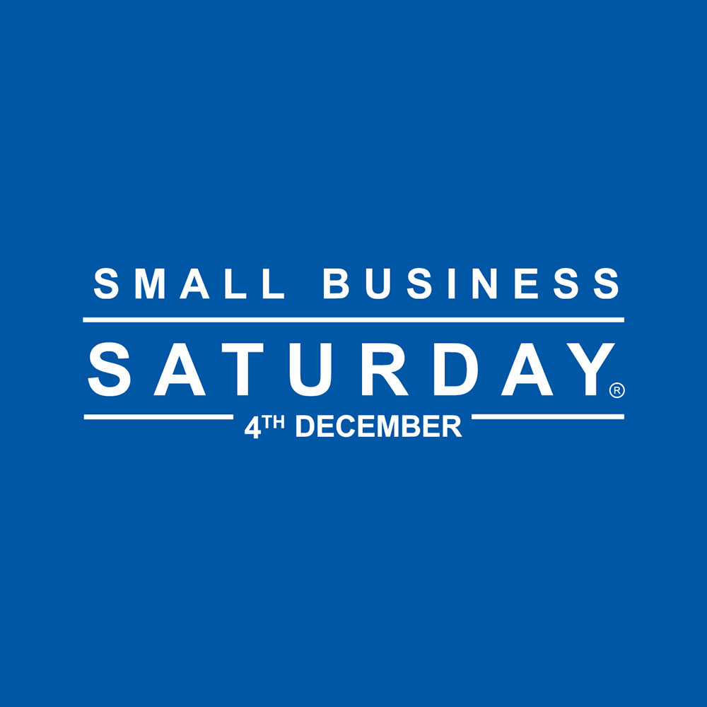 Blue sign with white writing saying Small Business Saturday
