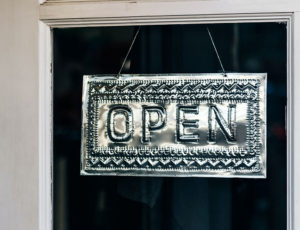 Open sign on door of retail store