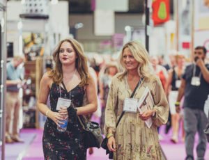 Two ladies walking down the hall of Moda and Spring Fair exhibition