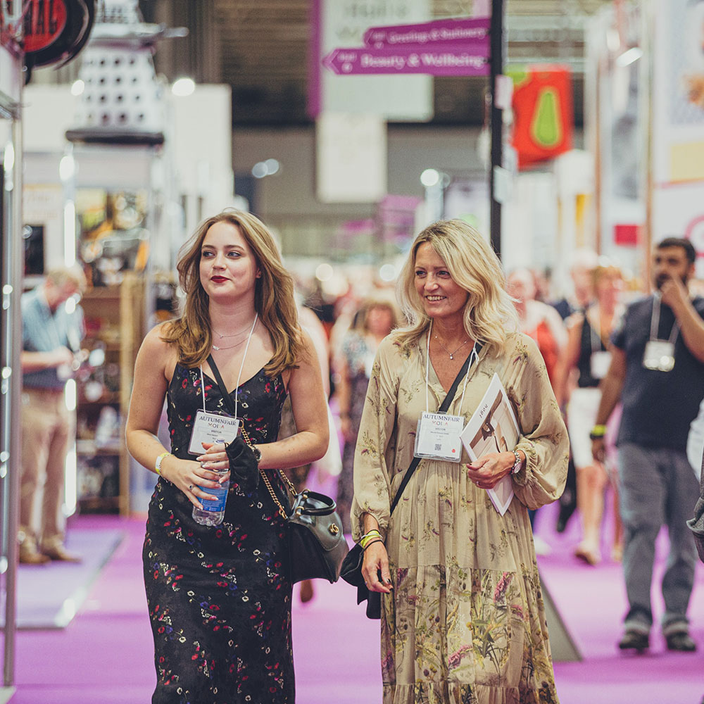 Two ladies walking down the hall of Moda and Spring Fair exhibition