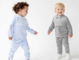 Two baby boys in blues and grey clothing