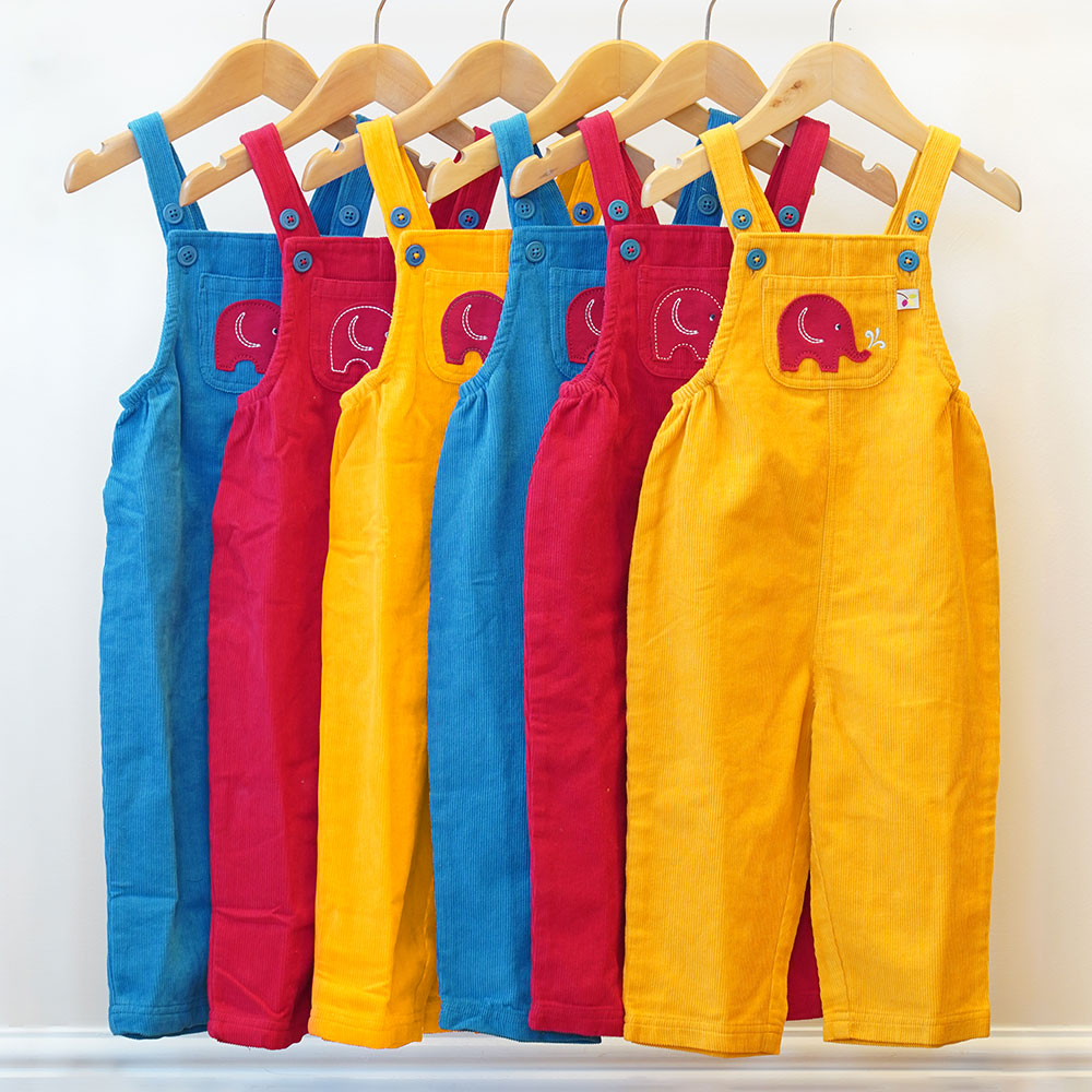 Yellow red and blue dungarees by Babipur on hangers