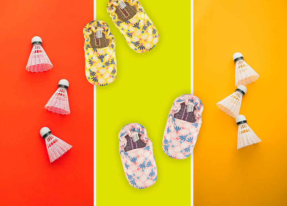 bright clourful baby shoes on bright background