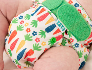 Babies reusable colourful print nappy with bright green fastener