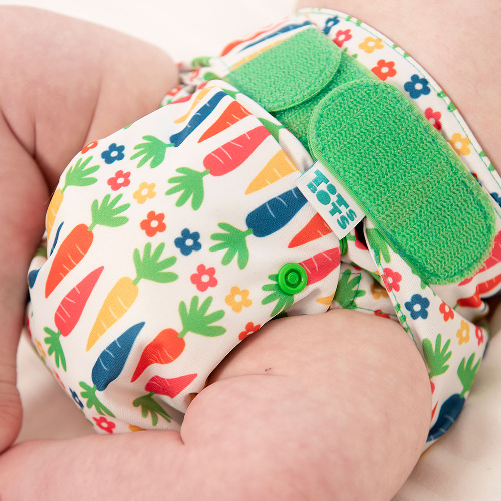 Babies reusable colourful print nappy with bright green fastener
