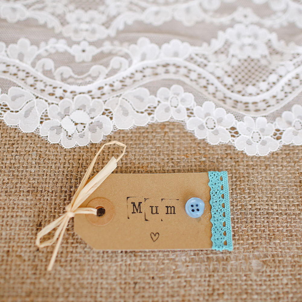 White lace and a paper gift tag with Mum printed - Mother's Day