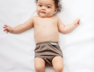 Baby in brown Splash About swimming nappy