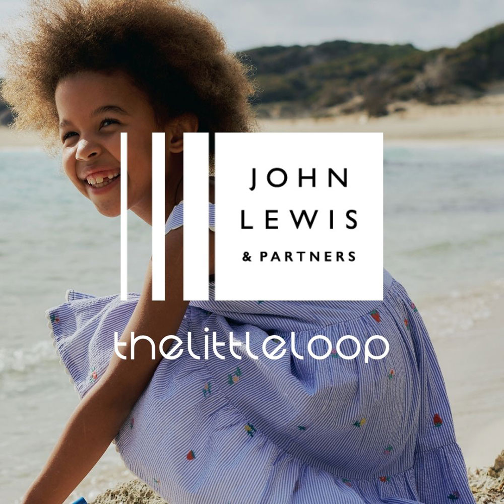 Young girl crouching wearing blue dress, John Lewis Logo on top of image