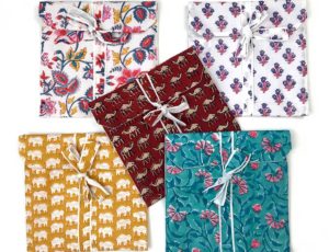 Five Awesome Blossom Pyjama sets in matching textile bags