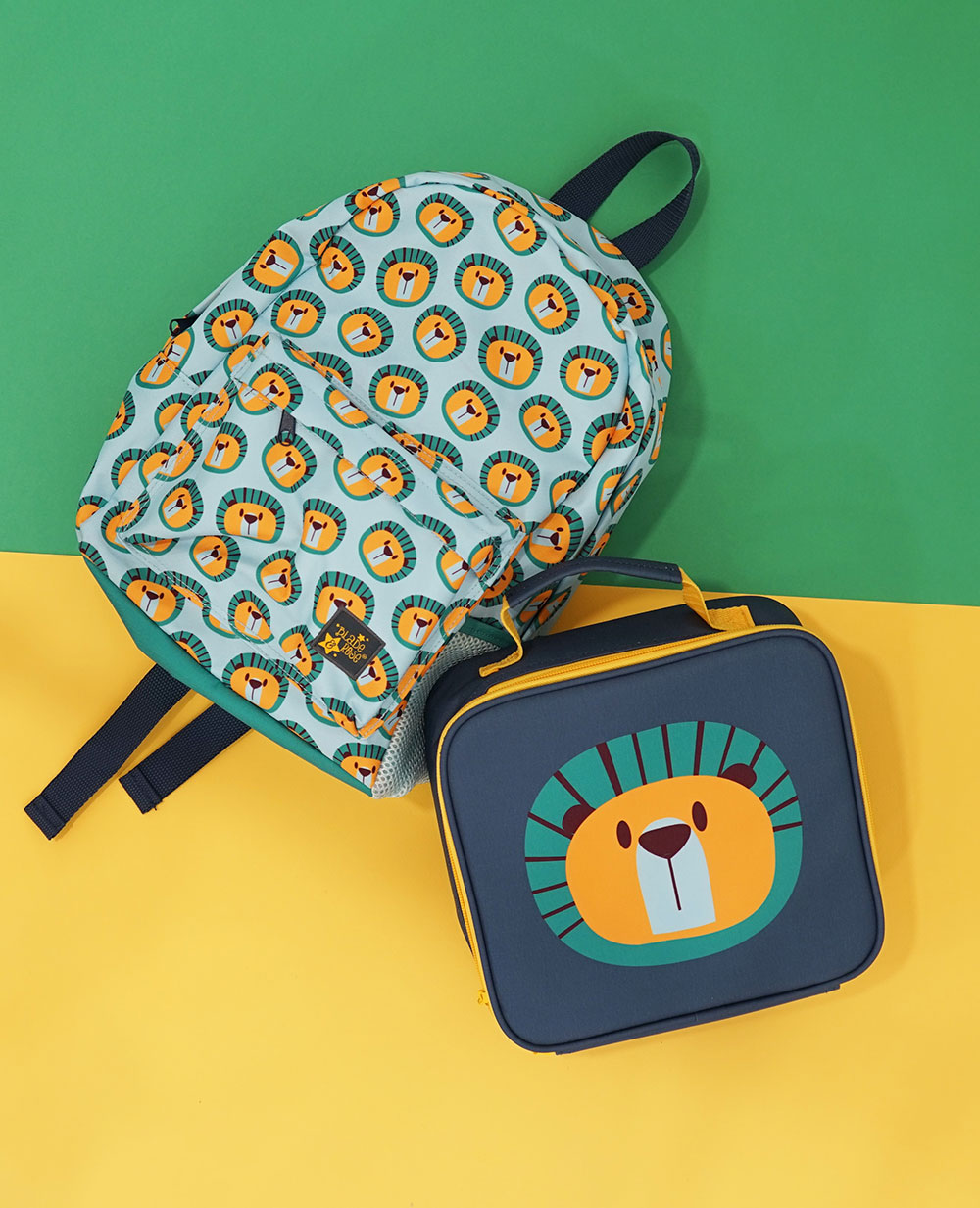 Back pack and lunchbox with a Frankie the lion pattern on them