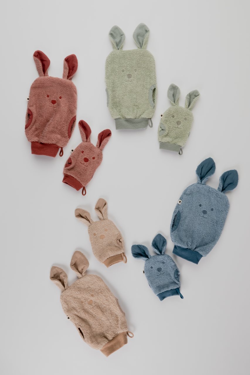bath time mitts feature a face and ears in various colours 