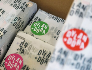 Parcels wrapped in Dylan + Dora branded packaging