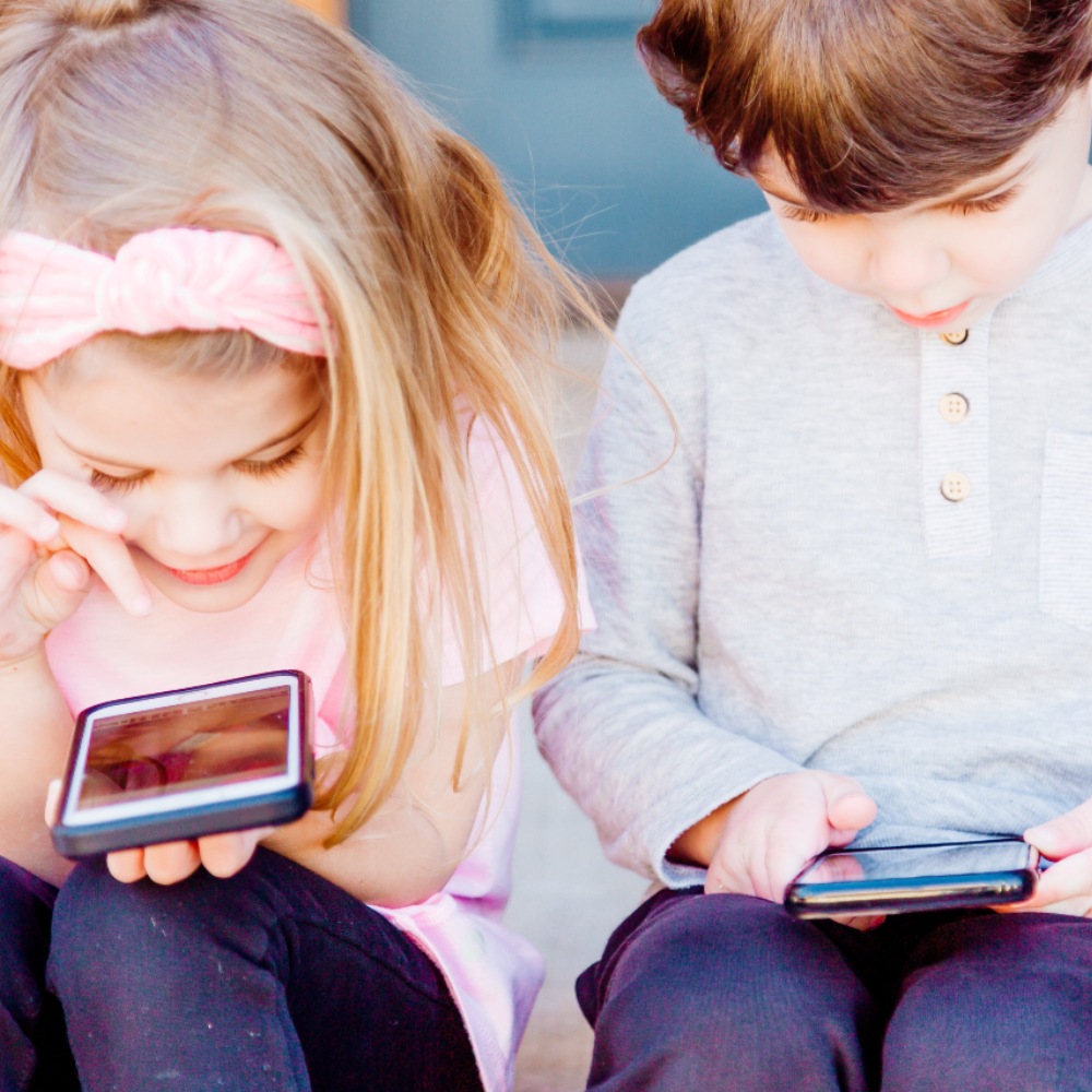 Children looking at smartphones