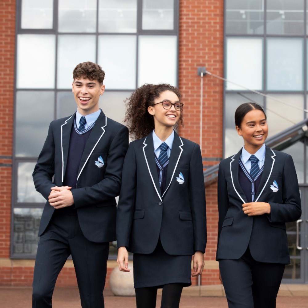 Three pupils walking wearing school uniform - the Schoolwear Association