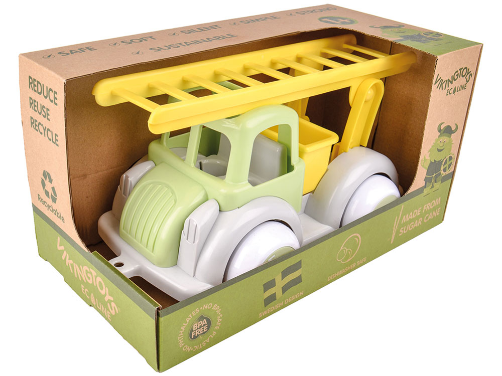 Green and yellow children's toy trunk in a box 