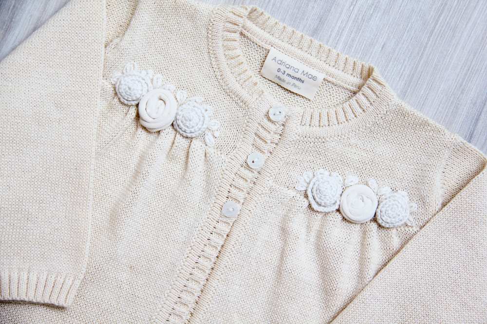 White knitted baby cardigan