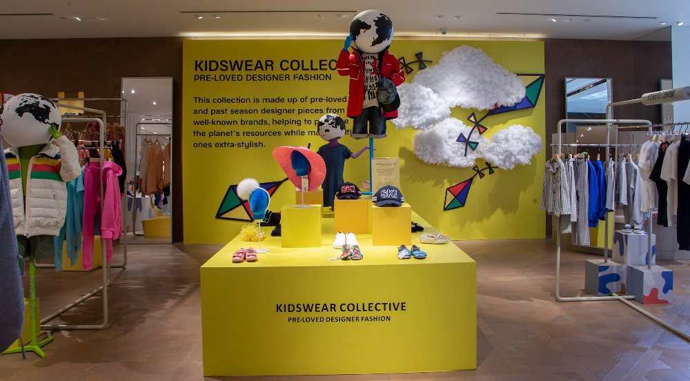 Inside of a shop showing a childrenswear display by Kidswear Collective