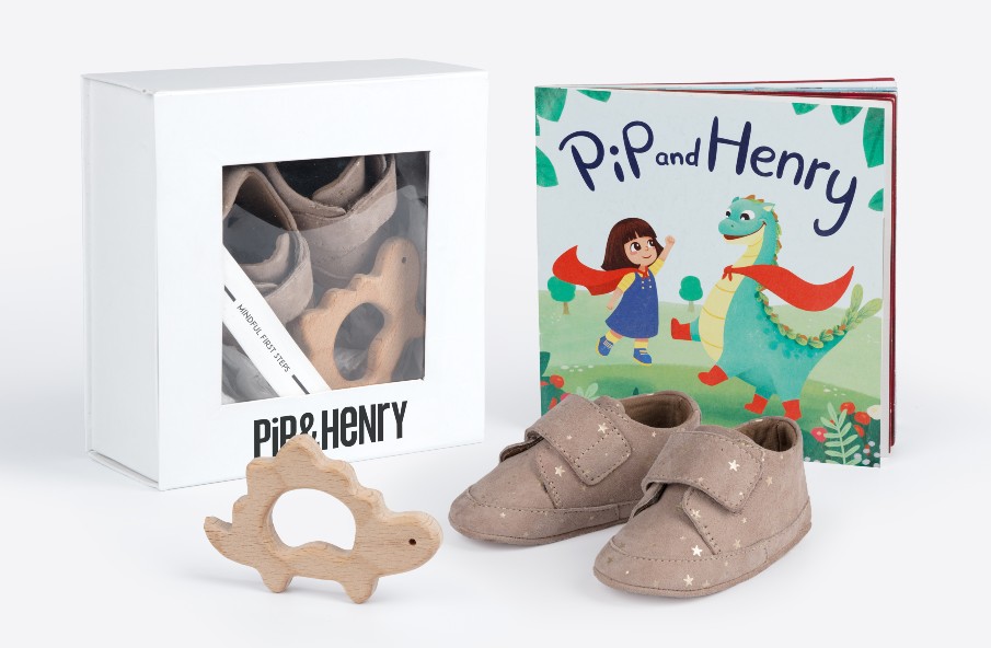 baby gift box containing a book, baby shoes and teether 