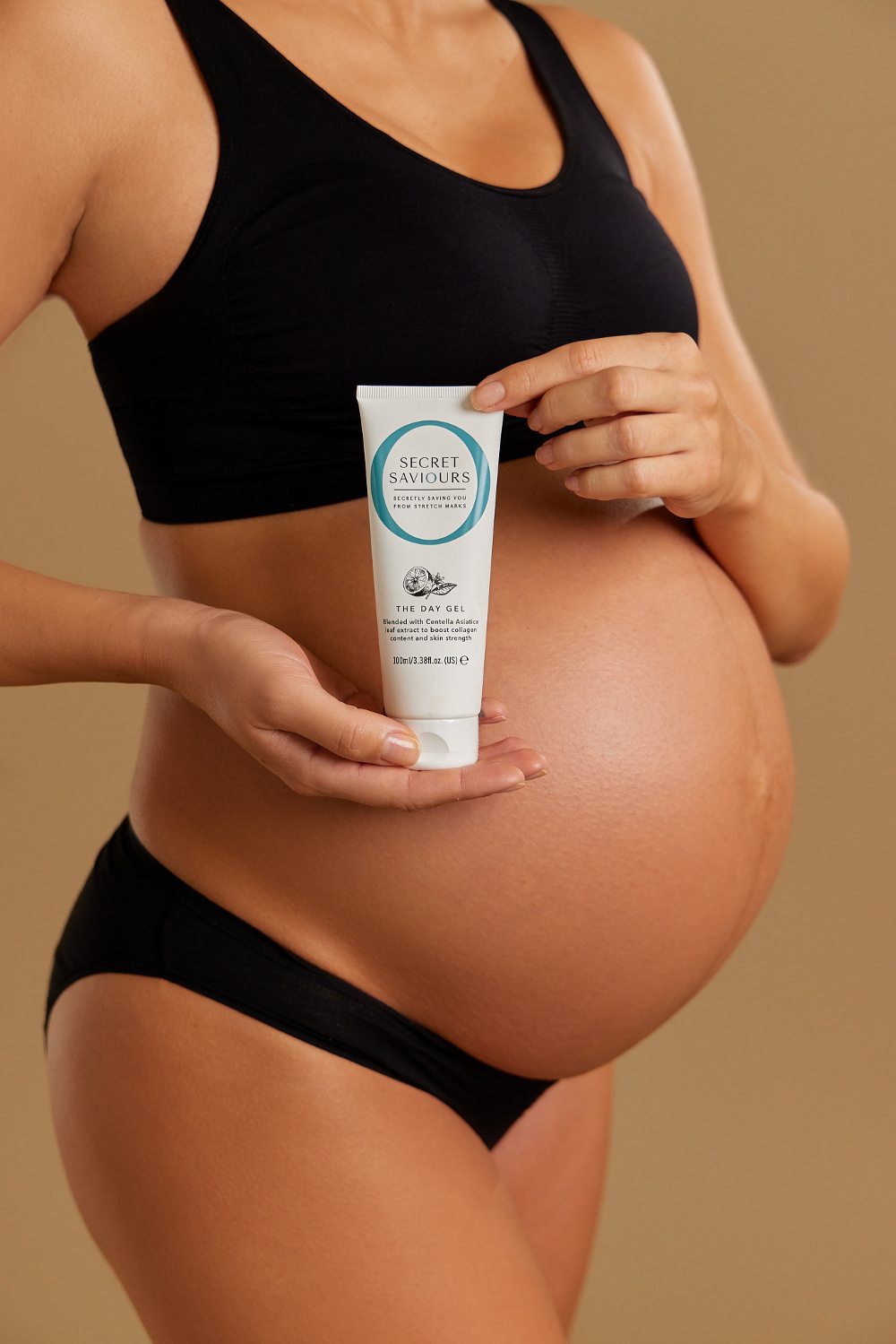 Pregnant woman holding a tube of cream by Secret Saviours 