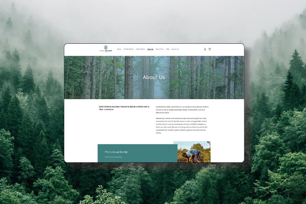 Homepage of the Earth Uniform website on a background of a forest with mist hanging above the trees