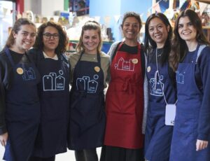 Kidly employees stood in a row volunteering for Little Village