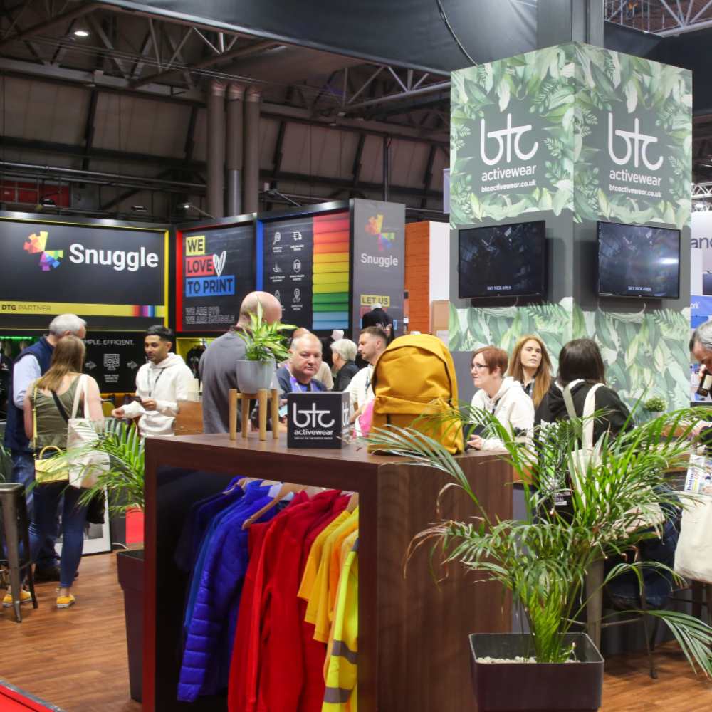 People stood on the BTC stand at Printwear & Promotion LIVE!