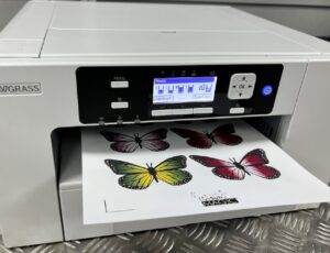 Printer with a piece of paper in the tray of butterflies