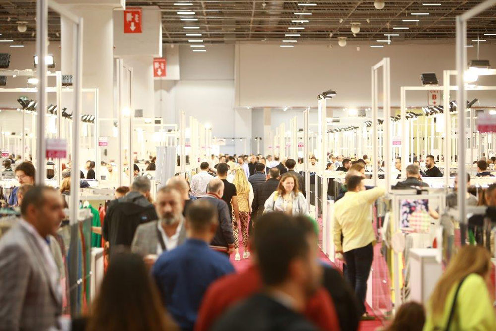 Visitors walking up and down the aisles at Texhibition