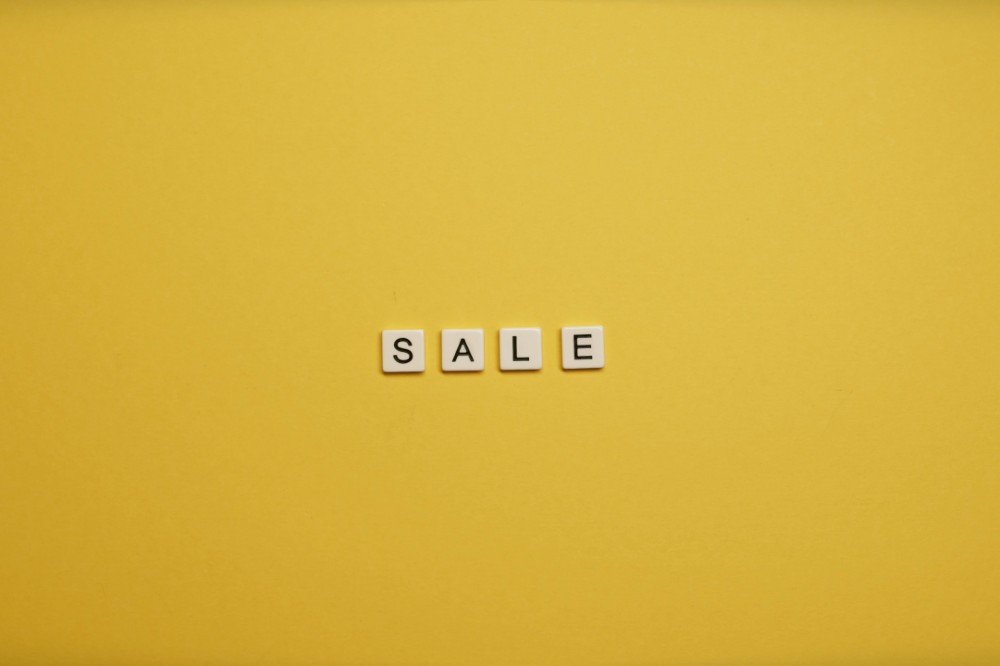 The word sale on a yellow background