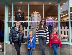 Four children stood outside the Young Nant Kids Wear shop