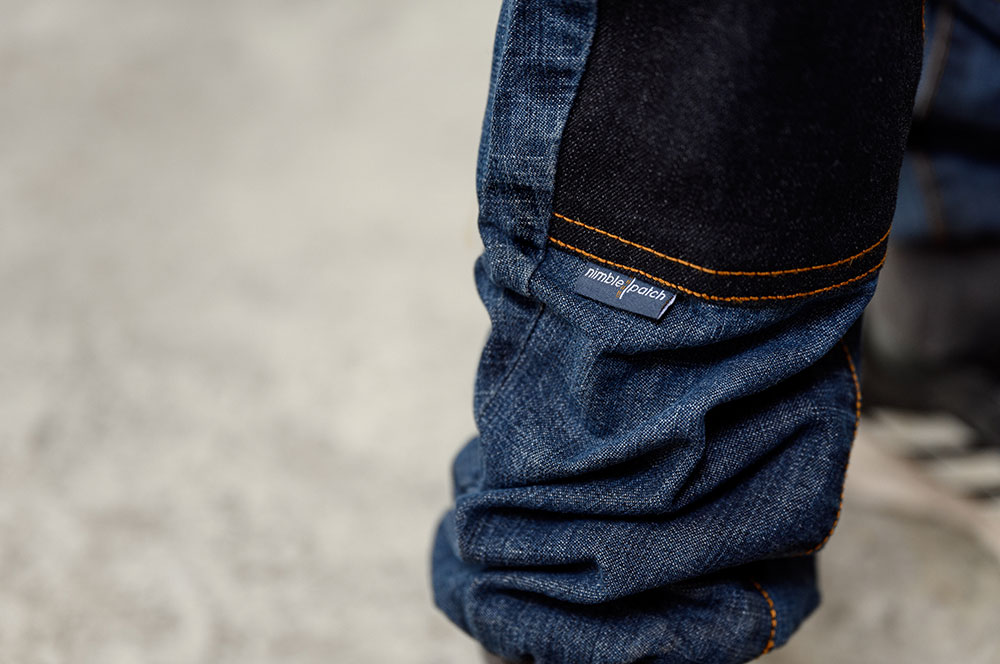 Close up of a Nimble Patch label on a pair of jeans