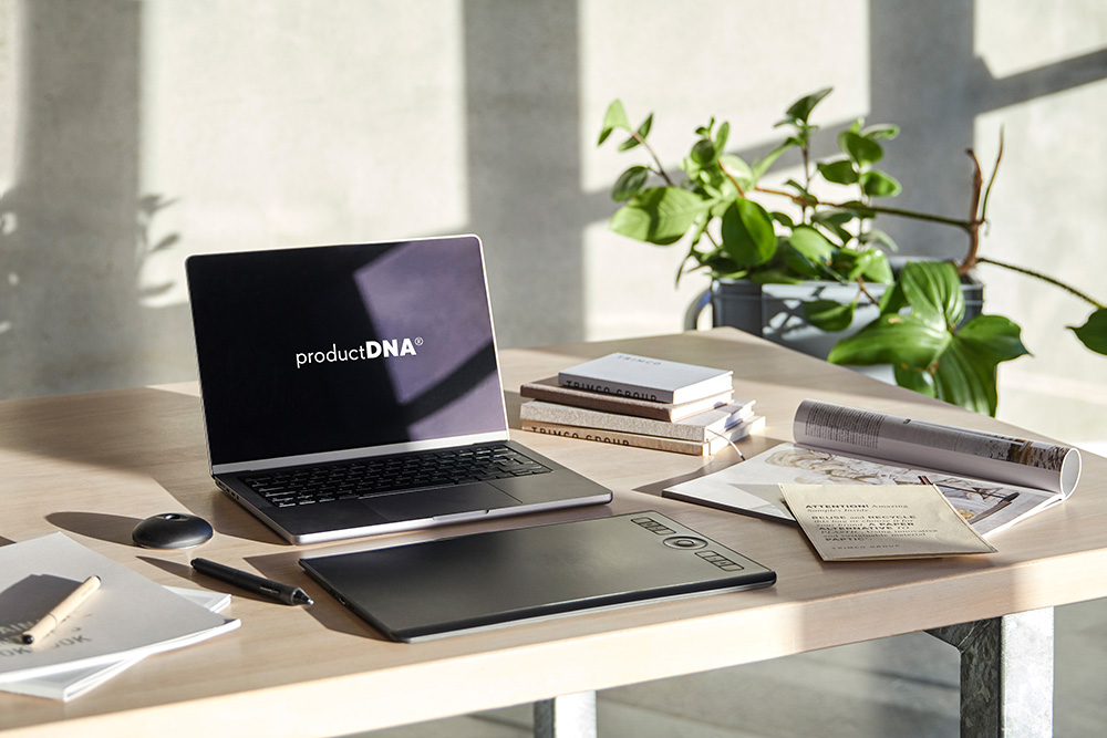 Laptop on a desk displaying ProductDNA on screen