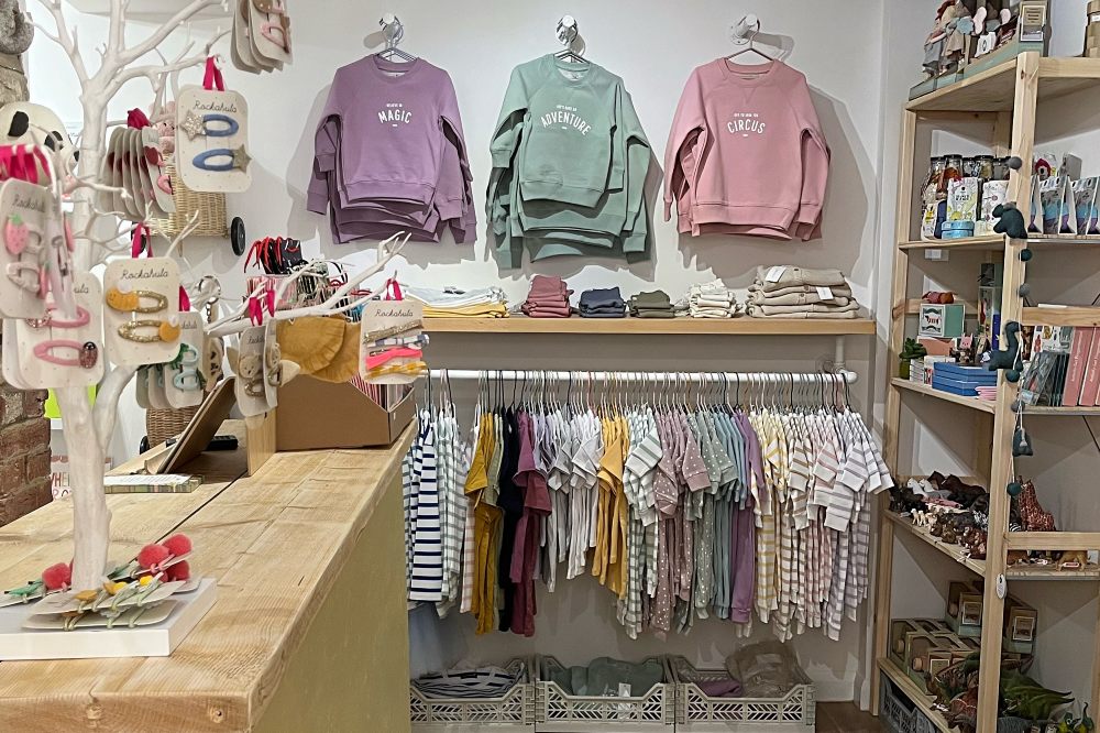 Children's clothes and accessories displayed in a shop