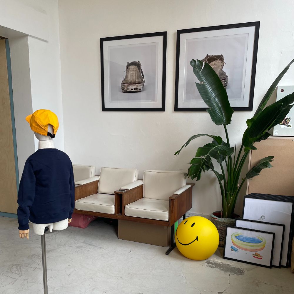 A room containing a children's mannequin and artwork