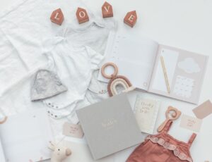 Baby journals by Cheeky Little Smiles displayed with baby products